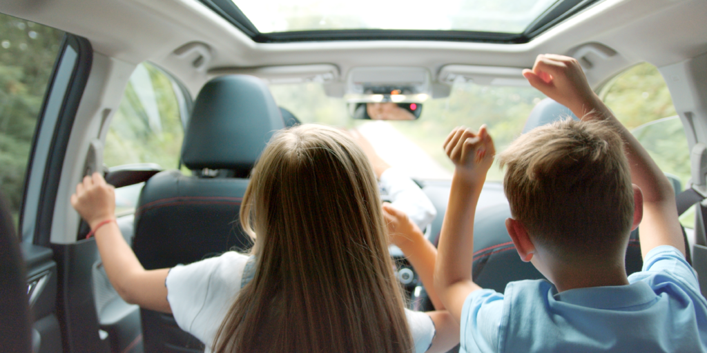 Family driving to car wash